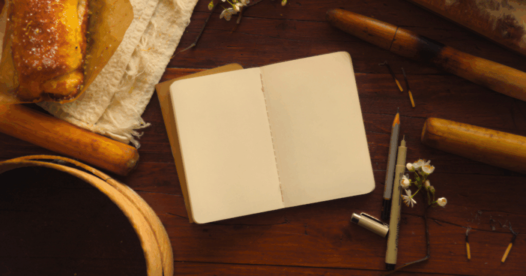 日記、ペン、パンの画像